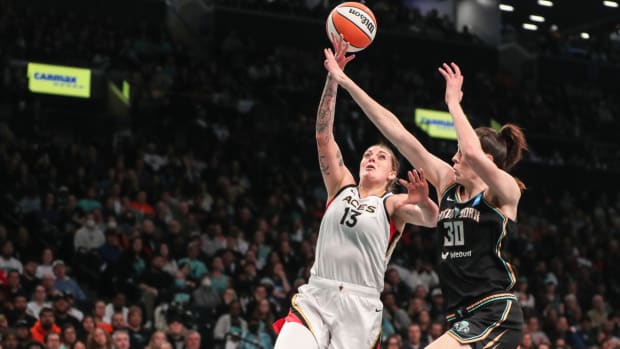 Aces forward Cayla George drives on Liberty forward Breanna Stewart during Game 4 of the 2023 WNBA Finals.